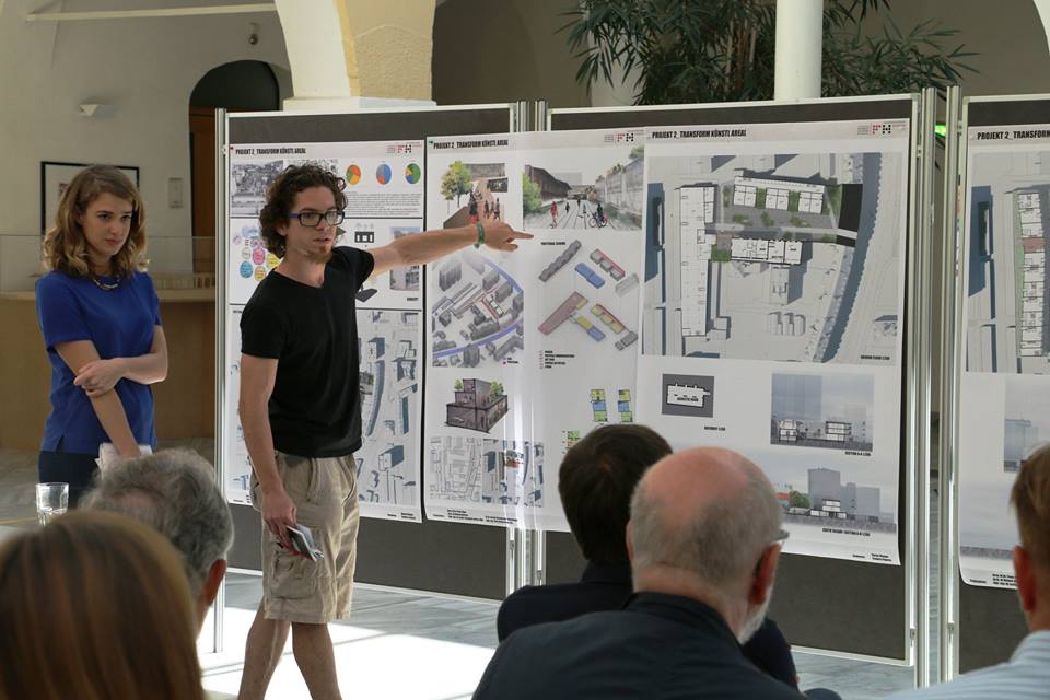 two people presenting at a white board